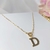 Colar Cartier de Letras Banhadas em Ouro 18K na internet