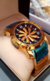 Bvlgari Speed Dourado com Fundo Preto