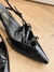 Miu Miu slingback em couro envernizado com fivelas - "preto" na internet