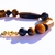 Pulseira Olho de Tigre com banho de ouro - comprar online