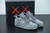 Air Jordan 4 Retrô 'Kaws Cool Grey'