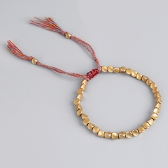 Pulsera de cuerda de la suerte con cuentas de cobre y algodón trenzado budista