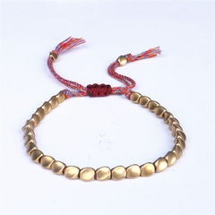 Pulsera de cuerda de la suerte con cuentas de cobre y algodón trenzado budista en internet