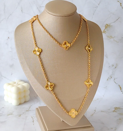 Colar longo dourado trevos