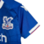 Imagem do Kit Infantil Crystal Palace I Macron 23/24 - Vermelho e azul com detalhes em branco