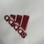 Logo da Adidas presente na Camisa Fluminense 110 anos Retrô 2012, com design discreto e elegante.