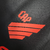 A camisa três do Athletico Paranaense é preta com quatro faixas diagonais vermelhas na parte inferior. Escudo e logo da Umbro também em vermelho, com os diamantes da Umbro em jaquard nas mangas.