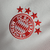 A camisa titular do Bayern de Munique 2023-2024 é branca com gola redonda vermelha. Escudo, logo da Adidas e patrocínio máster em vermelho. Três listras nos ombros em branco. Inscrições dentro da gola e na nuca em vermelho.