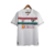 Camisa reserva do Fluminense: cor branca com faixas horizontais grená e verde, escudo do clube no lado esquerdo e logo da fornecedora no lado direito. Homenagem à Copa Rio de 1952 e grafismos estilizados nas mangas. Patch campeão da Libertadores 2023.