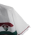 Camisa reserva do Fluminense: cor branca com faixas horizontais grená e verde, escudo do clube no lado esquerdo e logo da fornecedora no lado direito. Homenagem à Copa Rio de 1952 e grafismos estilizados nas mangas. Patch campeão da Libertadores 2023.