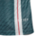 Camisa reserva Manchester United 23/24 versão jogador: Verde escuro com faixas verticais brancas e linhas vermelhas. Gola branca, três listras nos ombros em branco. Escudo Man United verde e branco, logo Adidas branco.