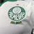 Manto reserva Palmeiras 2024: design igual ao titular, branco predominante, gola pólo e punhos verdes. Escudo no lado esquerdo, logo PUMA à direita.