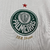 Manto reserva Palmeiras 2024: design igual ao titular, branco predominante, gola pólo e punhos verdes. Escudo no lado esquerdo, logo PUMA à direita.