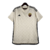 Camisa reserva da Roma 23/24 em cor creme com design de elementos arquitetônicos romanos. Detalhes em cinza carbono nas listras, escudo da Roma e logo Adidas bordados. Na nuca, destaque para a sigla 'ASR'.