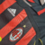 Camisa titular AC Milan 06/07 Adidas: modelo teamgeist com tradicional rubro-negro. Detalhes em dourado no tronco e nas mangas. Golo estilo polo preta com friso vermelho. Na nuca, escrito "Rossoneri" em dourado.