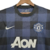 Camisa reserva Manchester United 13/14 Nike: camisa com padrão em xadrez em azul marinho e preto. Escudo Manchester United, logo Nike e patrocínio AON em branco.