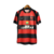 Camisa titular Flamengo 2003 Nike vista de frente. Rubro-negra com detalhes pretos nas laterais; mangas rubro-negras e gola redonda. Escudo Flamengo e logo Nike bordados.