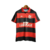 Camisa titular Flamengo 1992 Umbro vista da frente. Rubro-negra, com gola polo vermelha com detalhes pretos; manga com frisos detalhados em preto. Escudo CRF e logo Umbro gravados em branco.