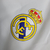 Jaqueta Corta-Vento Real Madrid 2023 - Masculina Adidas - Branca com detalhes em azul - loja online