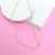 CHOKER DE PEDRAS BRANCAS BANHADA EM OURO 18K - comprar online