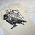 Camiseta Crow Blunt (Creme) - loja online