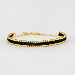 PULSERA LINE DORADO Y NEGRO - comprar online