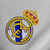 camisa do real madrid I 11/12 - retro - branca - torcedor - adidas - masculina - três linhas no ombro dourada - escudo - bordado - símbolo da adidas bordado - o punho em branco  - bwin- gola polo - cristiano ronaldo - png 5 . 