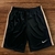 Shorts Nike Dry-Fit bordado masculino na cor preta com detalhes em bege.