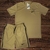 Conjunto masculino Nike Dry-Fit com camisa e short na cor bege, com logo da Nike em preto.