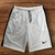 Shorts brancos Nike Dry-Fit bordados masculinos com detalhes em preto.