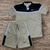 Conjunto masculino da Nike Dry-Fit, composto por camiseta e short com faixa no peito.