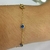 Pulseira de ouro amarelo com pedrinha redonda em zircônia azul - comprar online