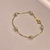 Pulseira infantil em ouro amarelo e perolas naturais - comprar online