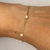 Pulseira infantil em ouro amarelo e perolas naturais na internet