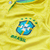 Camisa feminina amarela do Brasil, modelo 2022, com logo da CBF e detalhes em azul.