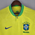 Camisa amarela do Brasil, modelo 2022, da Nike para torcedores masculinos, com detalhes em azul e verde.