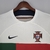 Camisa de futebol masculina da Nike, modelo Portugal II 22/23, na cor branca com detalhes em vermelho e verde.