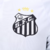 Camisa branca do Santos FC, modelo 24/25, com logo Umbro e escudo do clube.