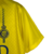 Camisa Al-Nassr I 23/24 Nike masculina, amarela com detalhes em azul, estampada com o logo da equipe e a marca.