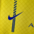 Camisa Al-Nassr I 23/24 Nike masculina, amarela com detalhes em azul, estampada com o logo da equipe e a marca.