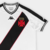 Camisa branca do Vasco da Gama II 24/25 com listras pretas e detalhes em vermelho, modelo torcedor Kappa masculina.