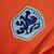 Camisa de futebol masculina laranja da Nike, com detalhes em azul e escudo da seleção da Holanda.