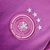 Camisa de futebol masculina da Alemanha II 24/25 da Adidas, na cor rosa com detalhes em roxo e design em gradiente.