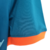 Image of Camisa Chelsea Treino 22/23 - Torcedor Nike Masculina - Azul com detalhes em laranja e preto