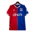 camisa-crystal-palace-I-1-2023-2024-23-24-azul-vermelha-macron-1