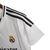 Image of Camisa Real Madrid I 24/25 - Torcedor Adidas Feminina - Branca com listras pretas