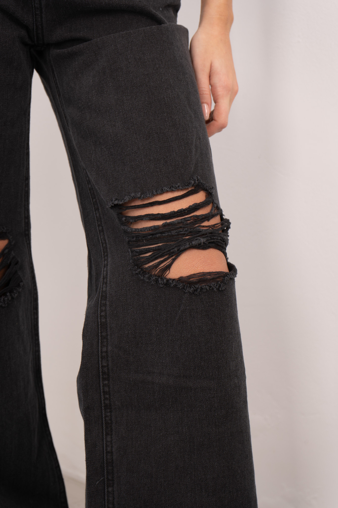 Jeans negro con online roturas