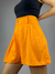 Shorts feminino soltinho laranja com botão - comprar online