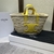 Celine Teen Triomphe Yellow" Bag: A bright yellow bag from Celine, standing out with the distinctive Triomphe logo, perfect for adding a touch of color and style to your look.