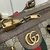 Gucci Savoy Small Duffle "Beige and Ebony GG Supreme" Travel Bag: A luxurious beige and brown Gucci travel bag featuring the iconic GG Supreme pattern and high-quality leather details.